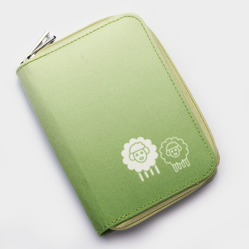 green needles case with 2 sheep