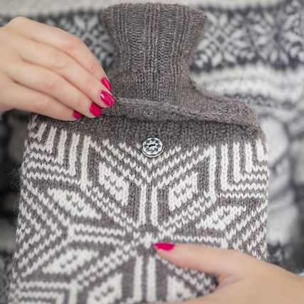 Close up of hot water bottle knitting pattern snowflake
