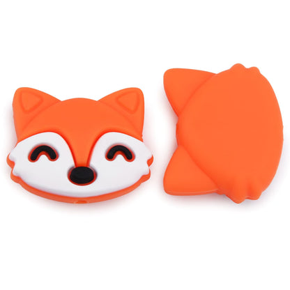 An orange and white silicone fox-shaped item shown from the front and back on a plain white background.