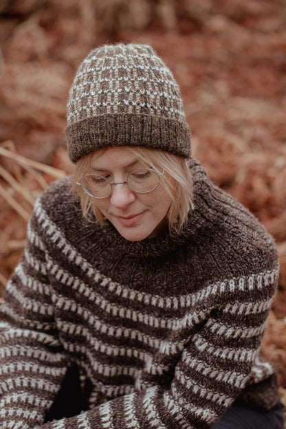 The Island and the Forest: A Knitted Correspondence